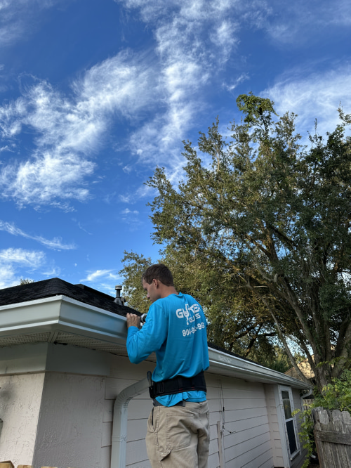 Attaching a gutter to a house